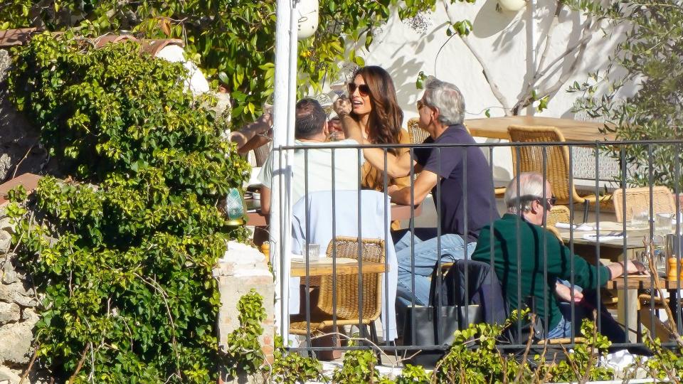 George and Amal later enjoyed lunch with their friends, with Nelson the St Bernard sat at their feet