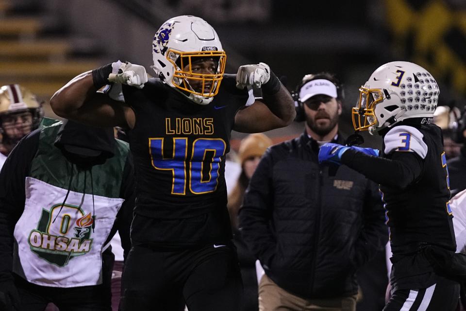 Gahanna's Kamari Burns (40) and Isaiah Wills-Jackson (3) celebrate a stop during last year's Division I regional final win against New Albany at Historic Crew Stadium.