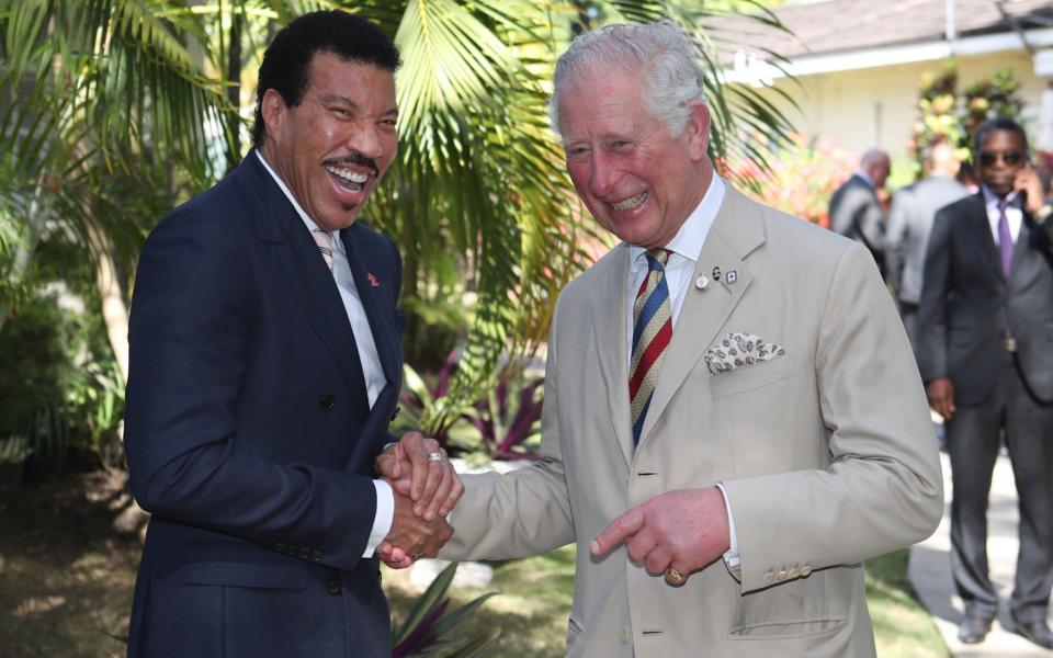 The Prince of Wales meets singer Lionel Richie at a Prince's Trust International Reception in Barbados in 2019 - PA