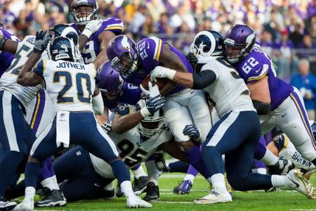 Nov 19, 2017; Minneapolis, MN, USA; Minnesota Vikings running back Latavius Murray (25) scores a touchdown in the fourth quarter against the Los Angeles Rams at U.S. Bank Stadium. Mandatory Credit: Brad Rempel-USA TODAY Sports