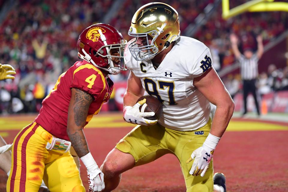 Notre Dame tight end Michael Mayer, scoring a touchdown against USC, leads the Irish in receiving with 67 catches for 809 yards and nine touchdowns.