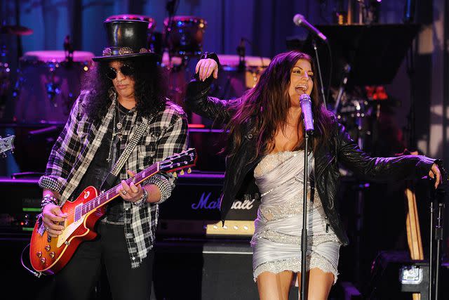 <p>MARK RALSTON/AFP via Getty</p> Slash and Fergie