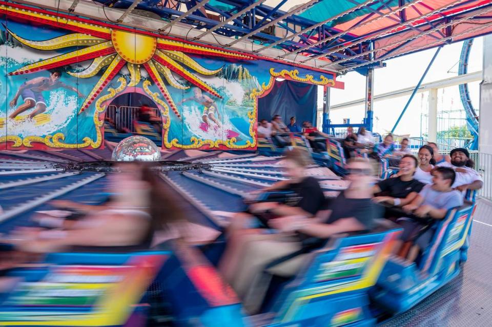 Guests laugh as the Hawaiian Express ride speeds up at the California State Fair on Sunday, July 17, 2022, at Cal Expo. The fair kicks off at Cal Expo in Sacramento on Friday, July 12, 2024.