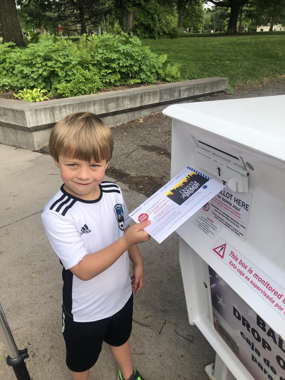 McReynolds' son Kenton, 7, helping her vote during Colorado's primary election this summer.<span class="copyright">Courtesy of Amber McReynolds</span>