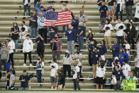 Fans stand during the playing of the national anthem before a baseball game between the New York Yankees and the Houston Astros Tuesday, May 4, 2021, in New York. (AP Photo/Frank Franklin II)