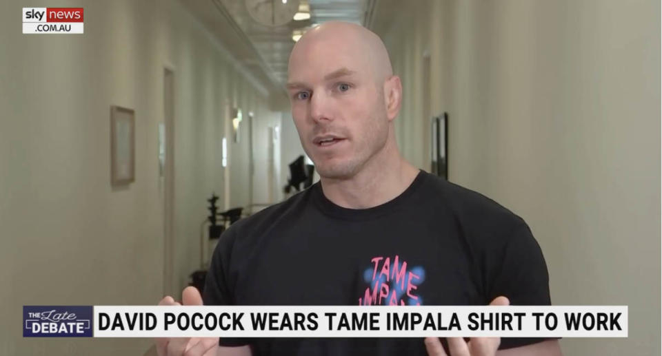 David Pocock in his t-shirt in the press gallery in Parliament House in Canberra.