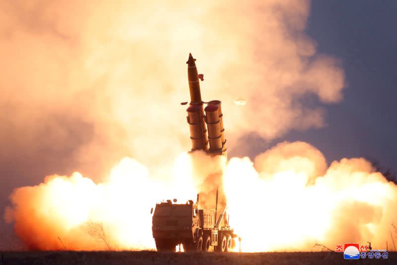 FILE PHOTO: A projectile is fired during North Korea's missile tests in this undated picture released by KCNA