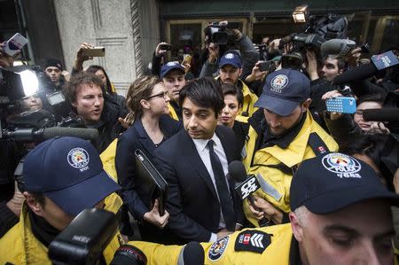 Canadian celebrity radio host Jian Ghomeshi leaves court after getting bail on multiple counts of sexual assault in Toronto November 26, 2014. REUTERS/Mark Blinch