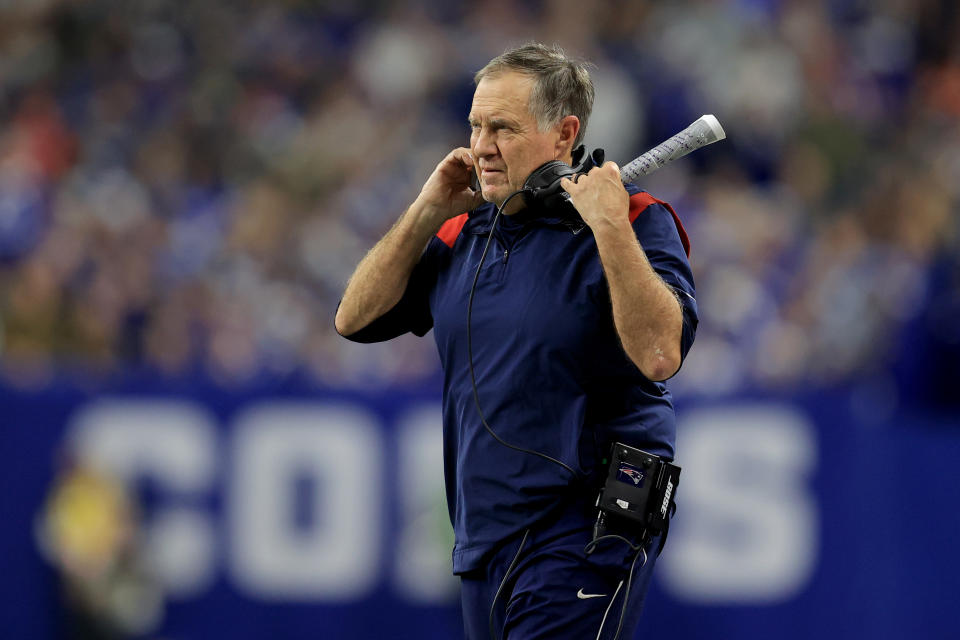 New England Patriots head coach Bill Belichick watches from the sidelines during the first half of an NFL football game against the Indianapolis Colts Saturday, Dec. 18, 2021, in Indianapolis. (AP Photo/Aaron Doster)