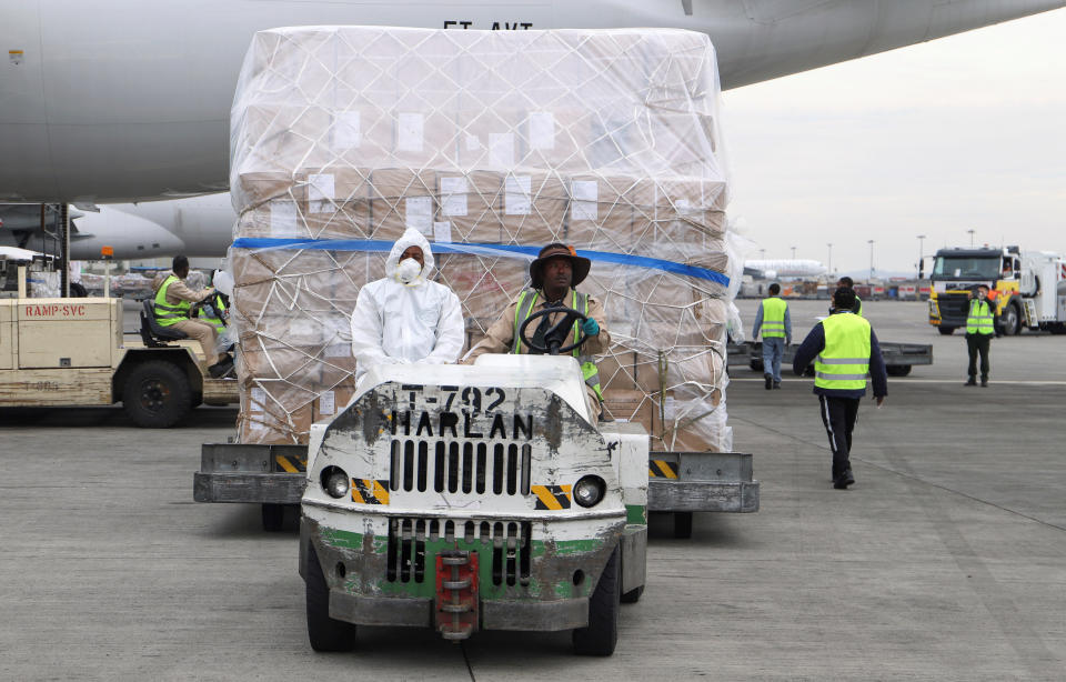 Ethiopian Airlines workers transport a consignment of medical donation from Chinese billionaire Jack Ma and Alibaba Foundation to Africa in Addis Ababa