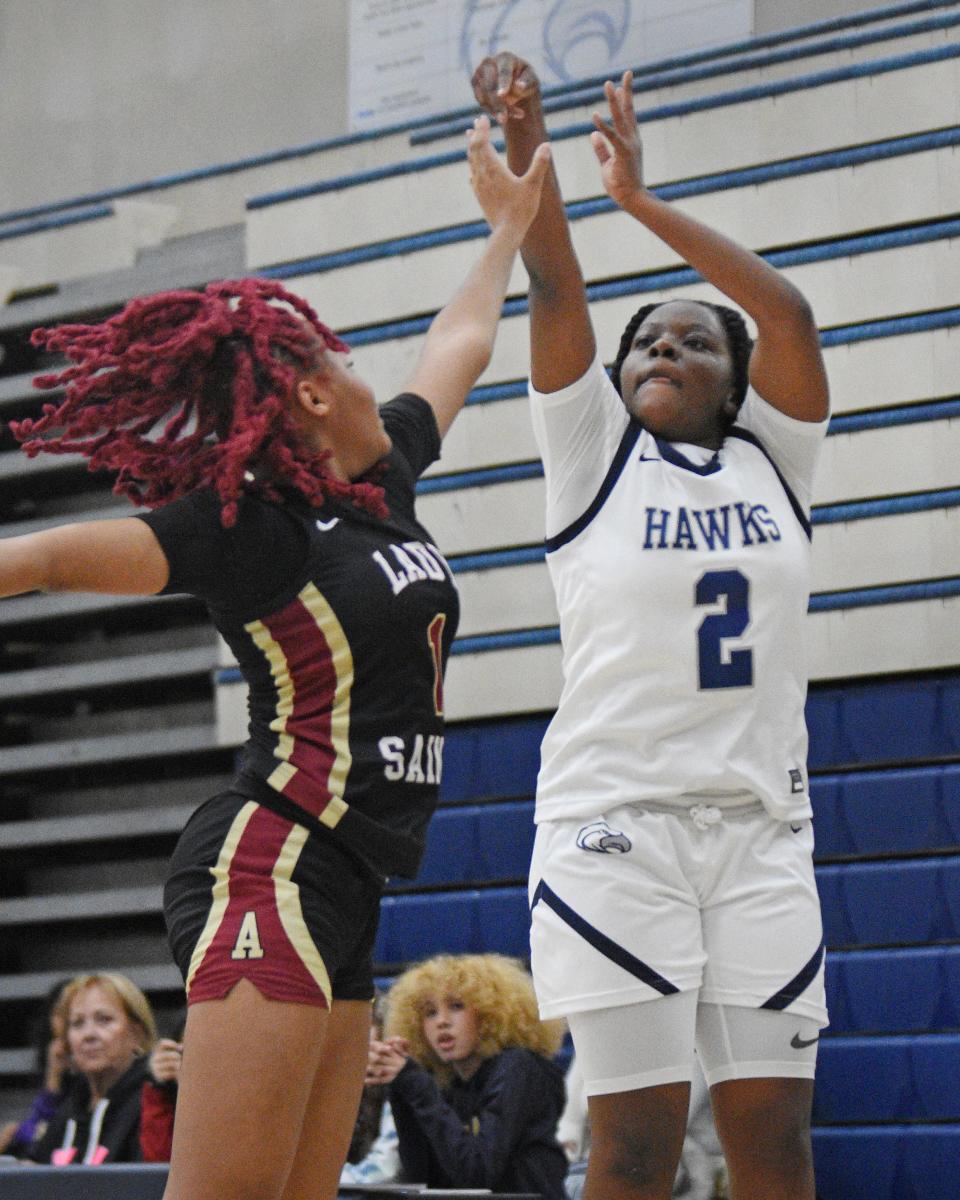 Silverado’s Elizabeth Udeze shoots a three-pointer while guarded by Adelanto’s Divine Flournoy during the third quarter on Tuesday, Jan. 9, 2024. Silverado defeated Adelanto 72-46 and improved to 2-0 in Desert Sky League action.
