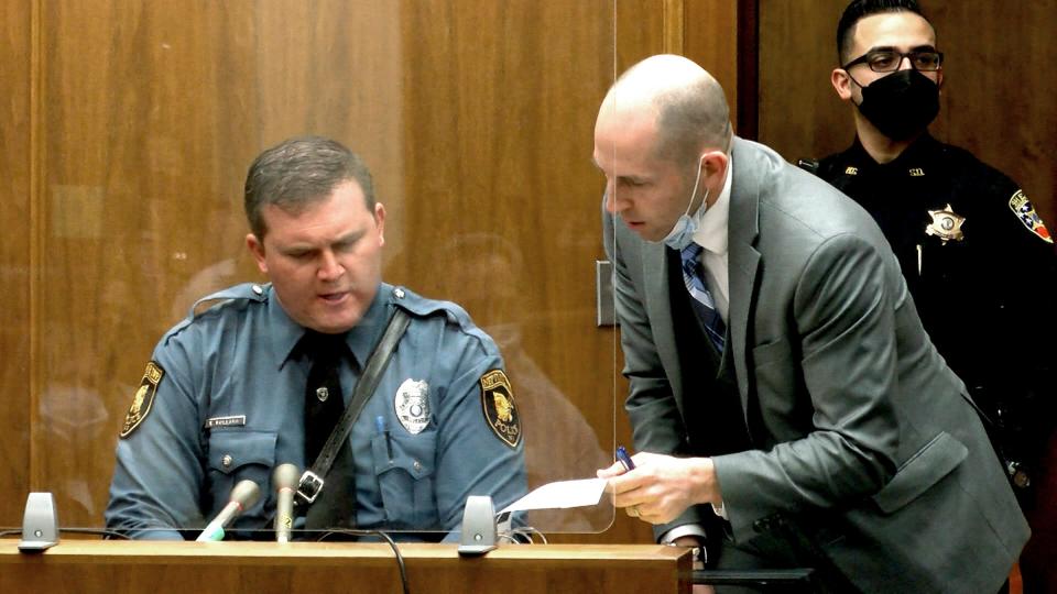 Monmouth County Assistant Prosecutor Joseph Cummings goes over a report with Neptune Township Police Officer Evan Pollara during Monique Moore's trial Tuesday, March 15, 2022, in State Superior Court in Freehold.   Moore is on trial before Judge Jill O'Malley for the 2016 stabbing murder in Neptune of Joseph Wilson, Jr. 