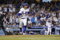 Los Angeles Dodgers' Mookie Betts runs to first after hitting a solo home run during the seventh inning of a baseball game against the Philadelphia Phillies Tuesday, June 15, 2021, in Los Angeles. (AP Photo/Mark J. Terrill)