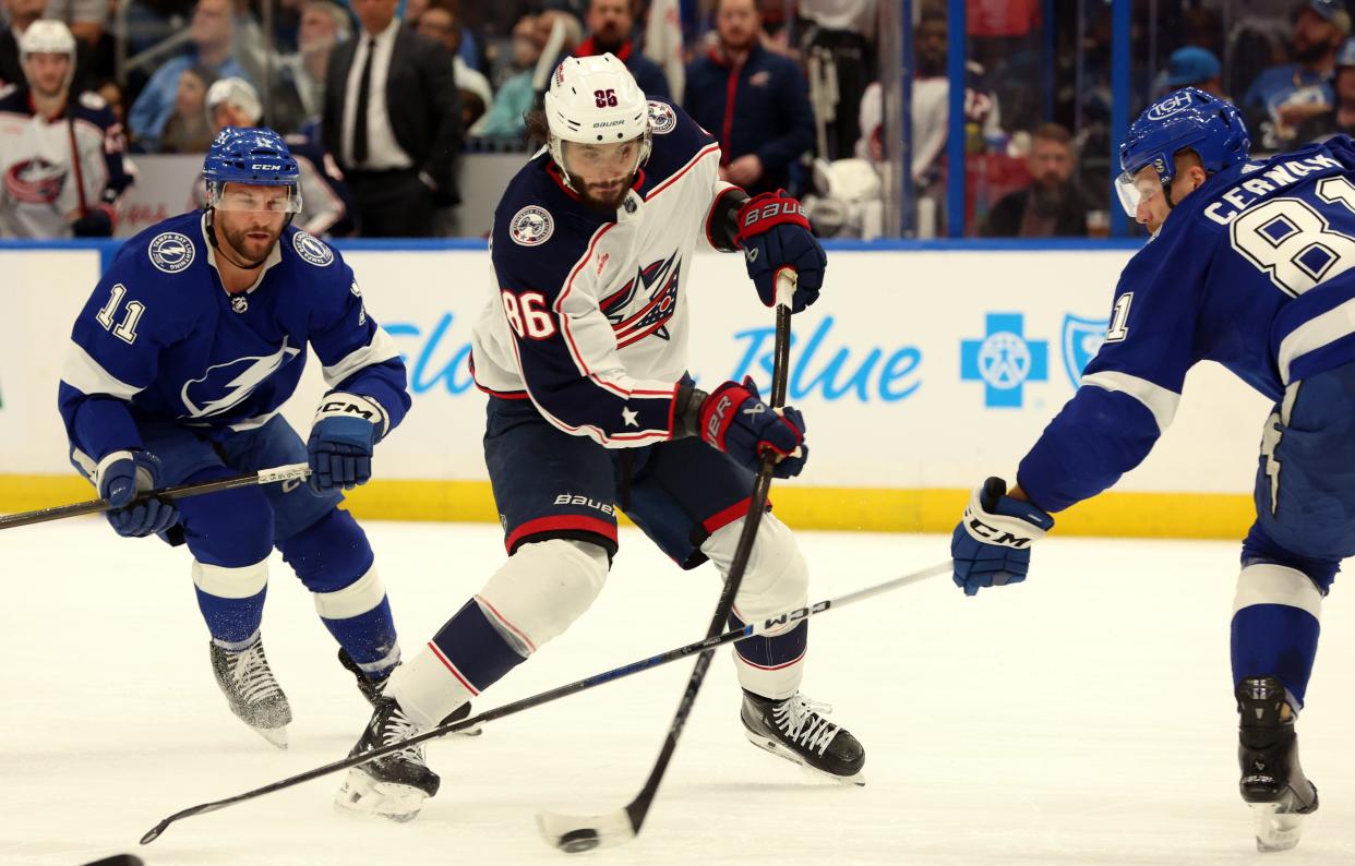 wApr 9, 2024; Tampa, Florida, USA; Columbus Blue Jackets right wing Kirill Marchenko (86) scores a goal as Tampa Bay Lightning defenseman Erik Cernak (81) and center Luke Glendening (11) attempted to defend during the second period at Amalie Arena. Mandatory Credit: Kim Klement Neitzel-USA TODAY Sports