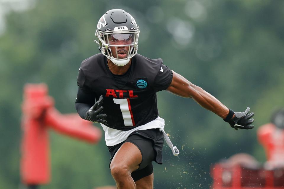 Atlanta Falcons cornerback Jeff Okudah (1) runs a drill during the NFL football team's training camp, Saturday, July 29, 2023, in Flowery Branch, Ga.