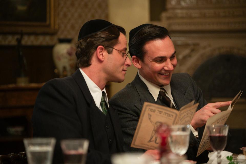 WE WERE THE LUCKY ONES, from left: Michael Aloni, Henry Lloyd-Hughes, 'Radom', (Season 1, ep. 101, aired Mar. 28, 2024). photo: Vlad Cioplea /©Hulu / Courtesy Everett Collection