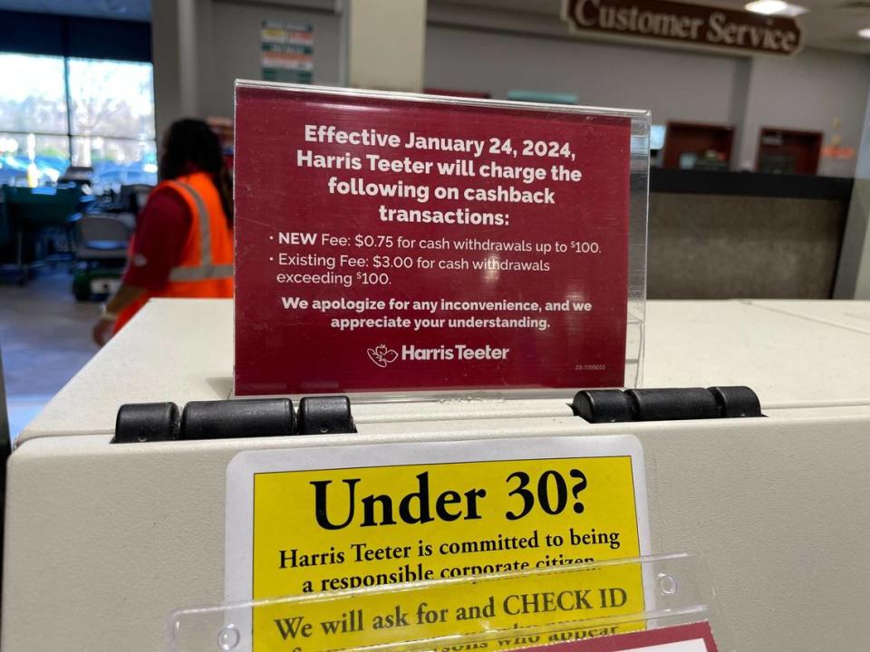 Harris Teeter has these signs in its stores alerting customers about the new cashback fees.