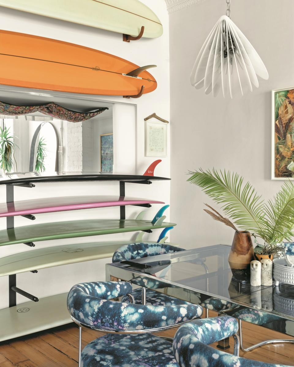 Can you tell the goal of this Williamsburg, Brooklyn, home was to have a permanent summer beach vacation vibe? Owned by Shanan Campanaro, owner of textile and design firm Eskayel, and her husband, Nick Chocana, the space is full of colors and materials reminiscent of the ocean. Sure, the surfboard decor is pretty direct, but the reupholstered vintage dining chairs give the seaside sensation, too.