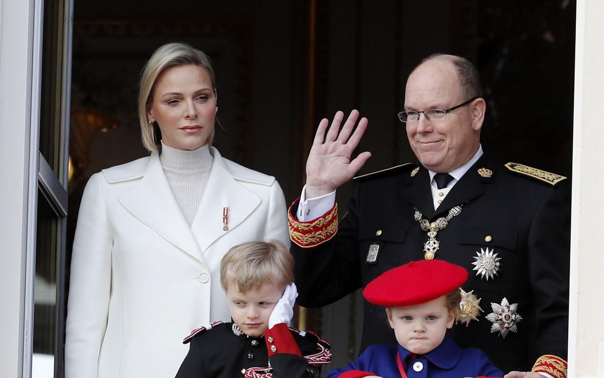 Monaco's Prince Albert II, his wife Princess Charlene, their twin children Prince Jacques and Princess Gabriella at the Monaco Palace in November 2019 - REX