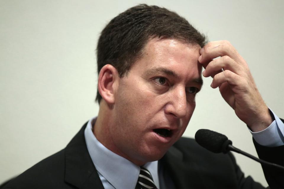 Glenn Greenwald, American journalist who first published the documents leaked by former NSA contractor Edward Snowden, testifies in front of the Brazilian Federal Senate's Parliamentary Inquiry Committee, established to investigate allegations of spying by United States on Brazil, in Brasilia October 9, 2013. REUTERS/Ueslei Marcelino (BRAZIL - Tags: POLITICS MEDIA)