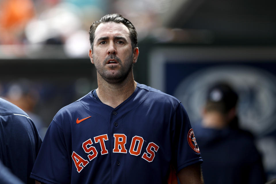 Houston Astros pitcher Justin Verlander walks in the dugout after pitching to the St. Louis Cardinals in the first inning of a spring training baseball game, Tuesday, March 3, 2020, in Jupiter, Fla. (AP Photo/Julio Cortez)