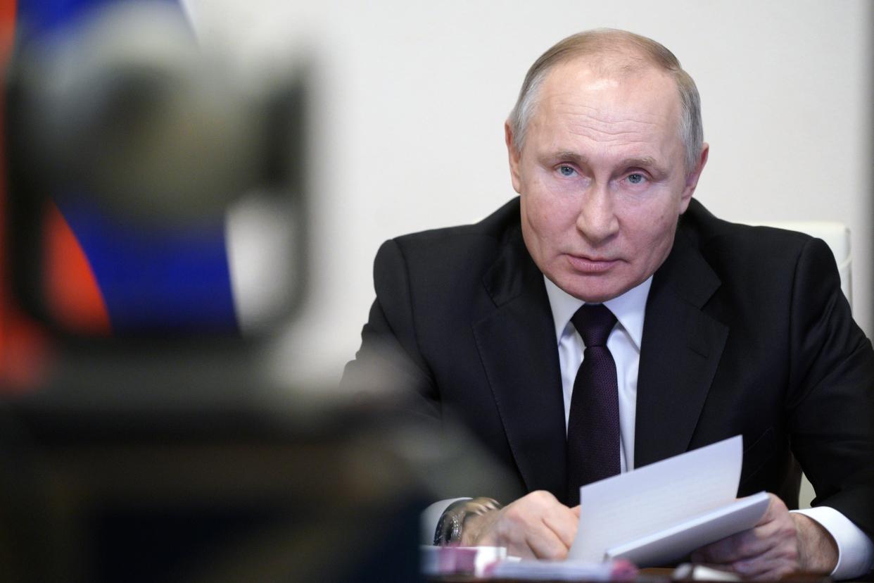 Russian President Vladimir Putin speaks during a meeting via video conference with officials and government cabinet members in Moscow, Russia, Thursday, March 11, 2021. (Alexei Druzhinin, Sputnik, Kremlin Pool Photo via AP)
