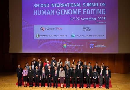 Hong Kong Executive Carrie Lam (C) and guests pose for a group photo during the International Summit on Human Genome Editing in Hong Kong, China November 27, 2018. Zhang Wei/CNS via REUTERS