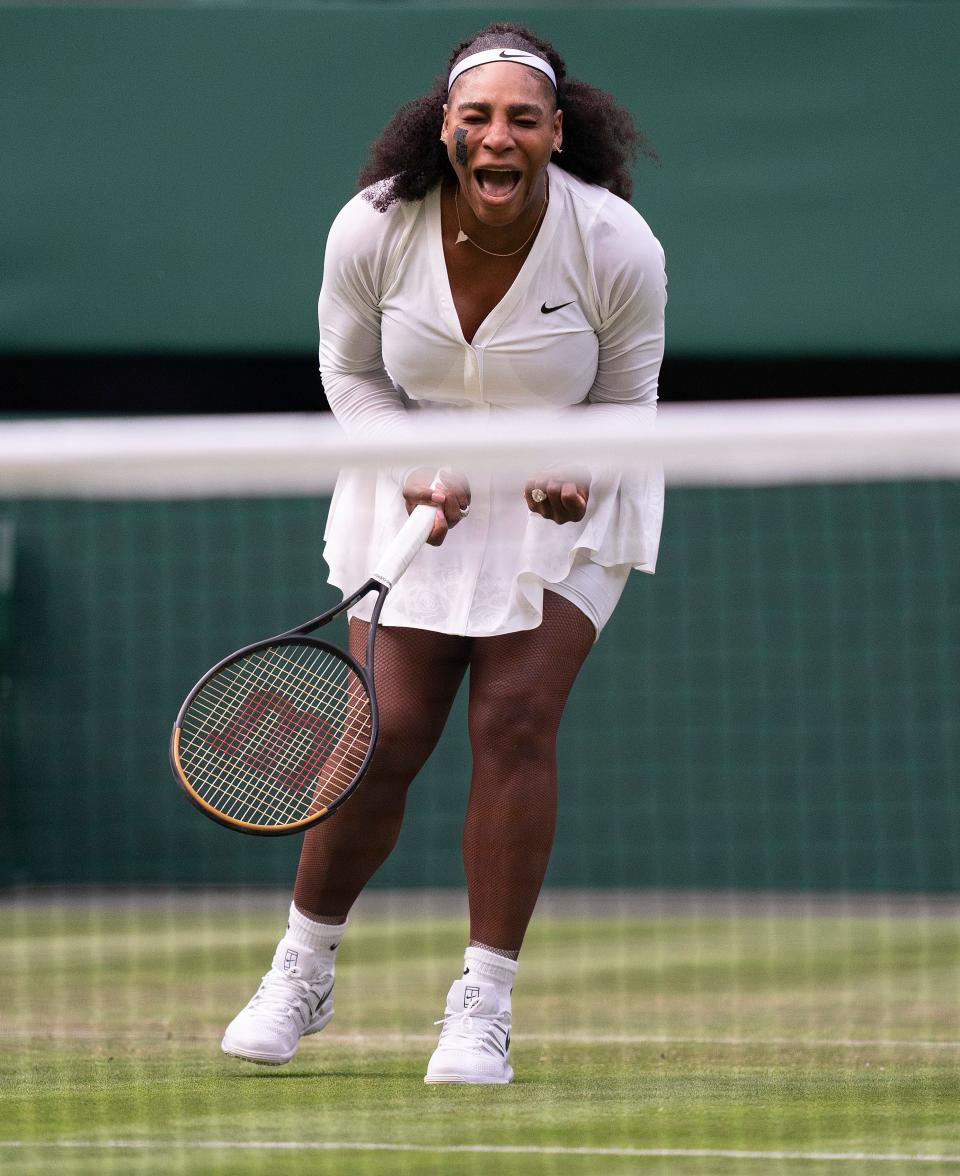 Serena Williams (USA) reacts to a point during her first-round match against Harmony Tan (FRA) on day two at All England Lawn Tennis and Croquet Club.