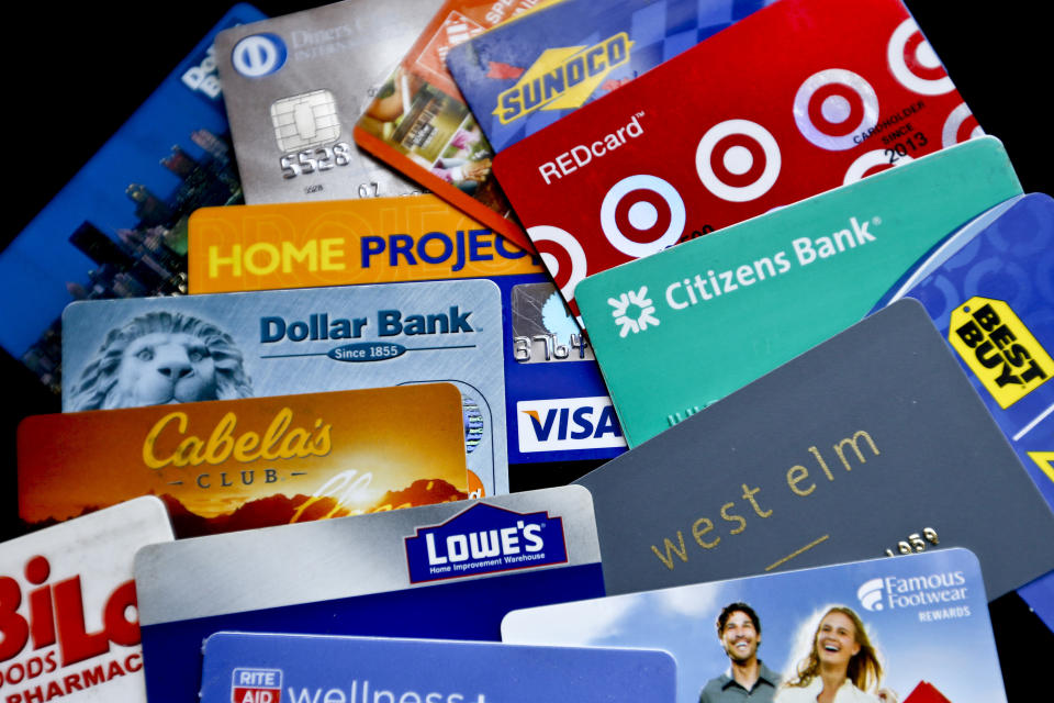 In this Jan. 31, 2018, file photo, an assortment of credit cards and rewards cards are shown in Zelienople, Pa. (AP Photo/Keith Srakocic)