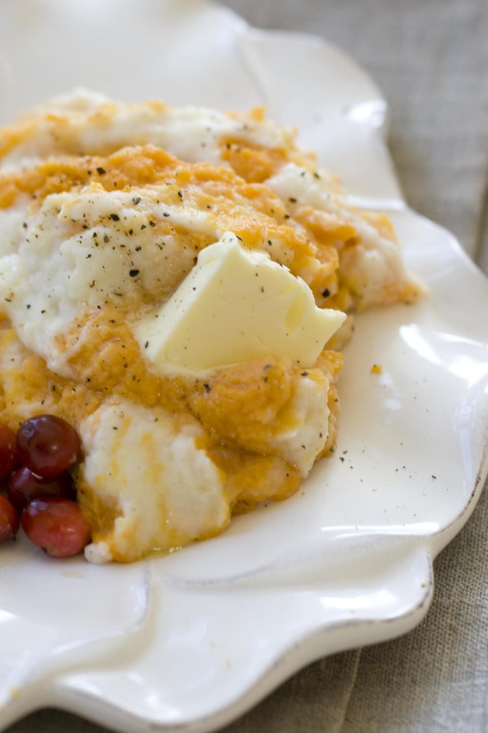 This Oct. 14, 2013 photo shows orange sweet potatoes swirled with Parmesan cauliflower puree in Concord, N.H. (AP Photo/Matthew Mead)