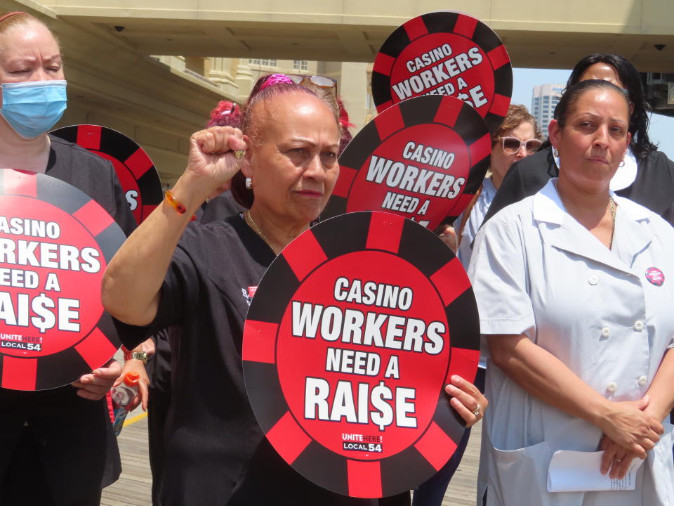 Casino housekeeping workers hold a press conference on the Atlantic City, N.J., Boardwalk on Wednesday, June 8, 2022 at which they accused four casinos of failing to clean each occupied hotel room daily as required by an executive order from New Jersey's governor. (AP Photo/Wayne Parry)