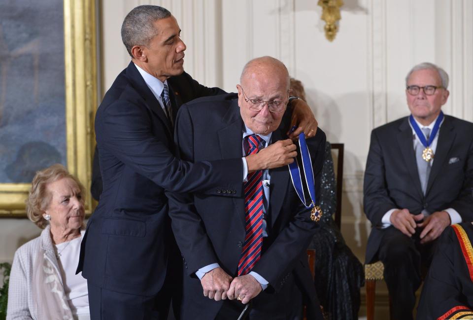 President Barack Obama presents the Presidential Medal of Freedom to Dingell during a ceremony in the East Room of the White House on Nov. 24, 2014.