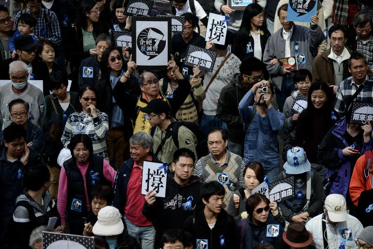 Protesters march for press freedom in Hong Kong on February 23, 2014