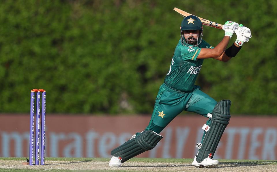 Babar Azam of Pakistan hits the ball towards the boundary during the Pakistan and West Indies warm Up Match prior to the ICC Men's T20 World Cup at on October 18, 2021 in Dubai, United Arab Emirates - Matthew Lewis-ICC/ICC via Getty Images