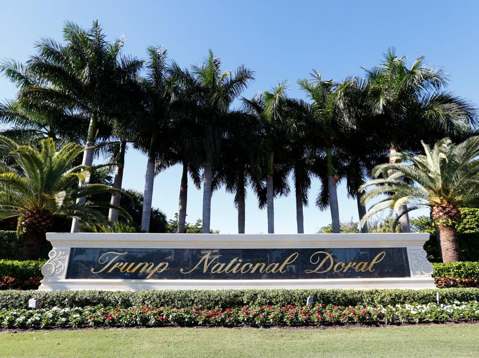 In this Nov. 20, 2019 photo, the entrance to the Trump National Doral resort is shown in Doral, Fla. The Trump golf resort in South Florida where President Donald Trump initially wanted to host this year's Group of Seven summit has temporarily laid off over 500 workers. (AP Photo/Wilfredo Lee)