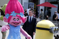 California Governor Gavin Newsom arrives to a news conference at Universal Studios in Universal City, Calif., on Tuesday, June 15, 2021. Starting Tuesday, there were no more state rules on social distancing, and no more limits on capacity at restaurants, bars, supermarkets, gyms, stadiums or anywhere else. (AP Photo/Ringo H.W. Chiu)