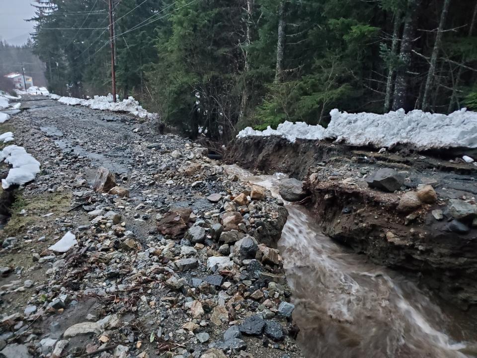 This photo provided by the Alaska Department of Transportation and Public Facilities shows damage from heavy rains and a mudslide 600 feet wide in Haines, Alaska, on Wednesday, Dec. 2, 2020. Authorities say six people are unaccounted for, and four homes were destroyed in the slide, with the search resuming Thursday morning for survivors. (Matt Boron/Alaska Department of Transportation and Public Facilities via AP)