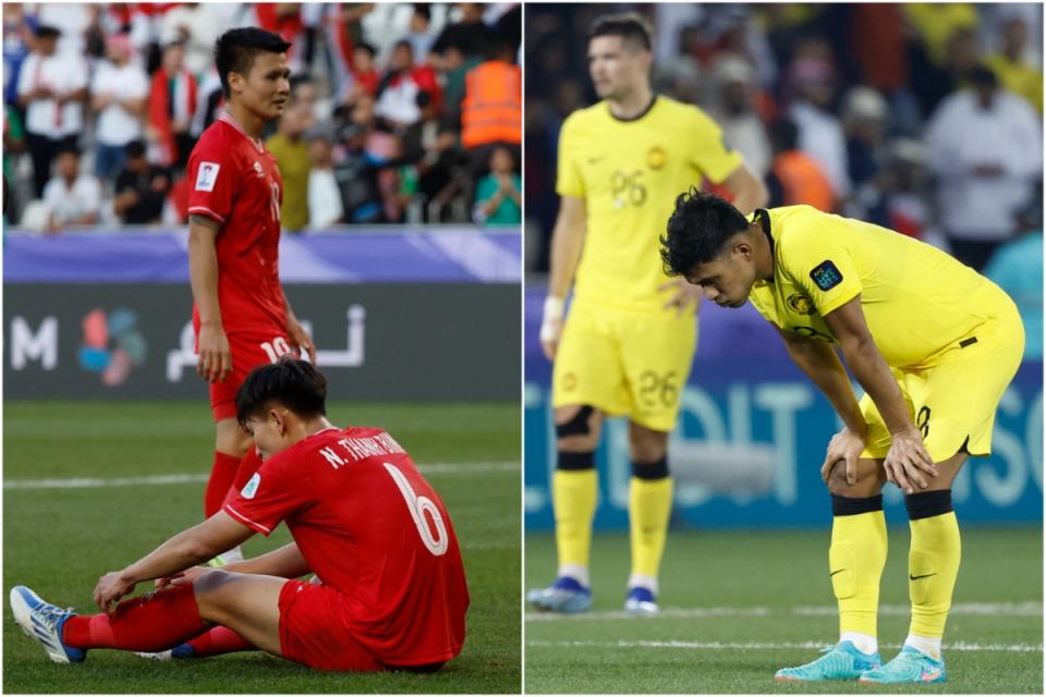 越南（左）和马来西亚国家队在 2023 年亚足联亚洲杯小组赛中出局后感到失望。  （图：法新社）