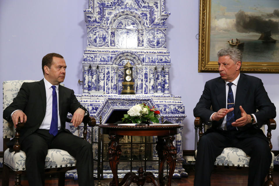 Russian Prime Minister Dmitry Medvedev, left, talks with Ukrainian presidential candidate Yuri Boyko during their meeting in Moscow, Russia, Friday, March 22, 2019. A Ukrainian presidential candidate has traveled to Moscow to meet with the Russian prime minister to discuss gas supplies. (Yekaterina Shtukina, Sputnik, Government Pool Photo via AP)