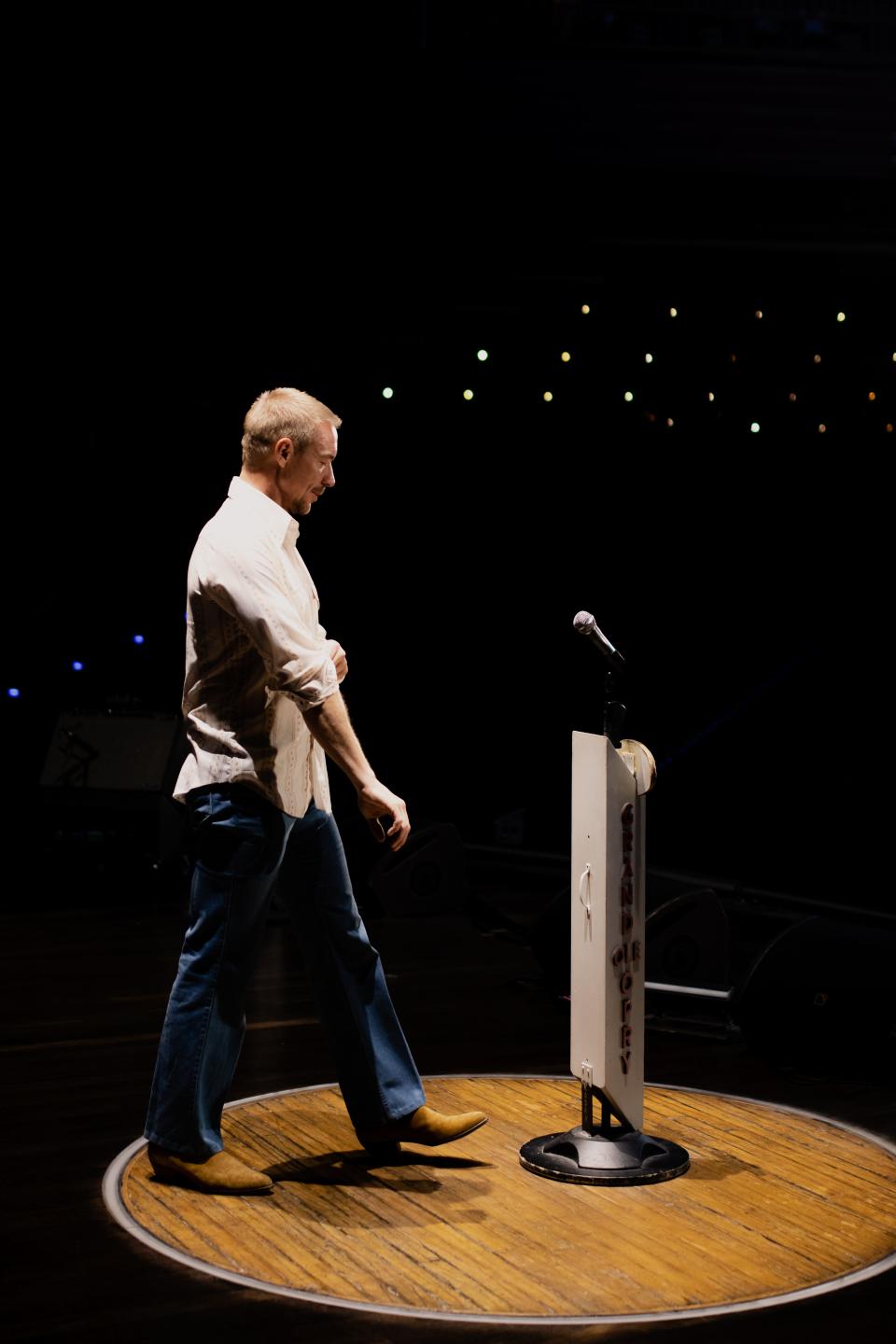 Diplo steps into the circle at the Grand Ole Opry stage.