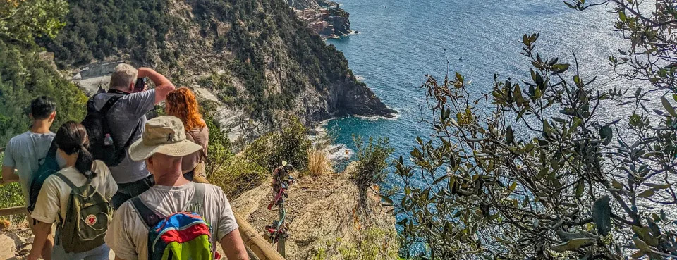 Brent hiking down a trail packed with people