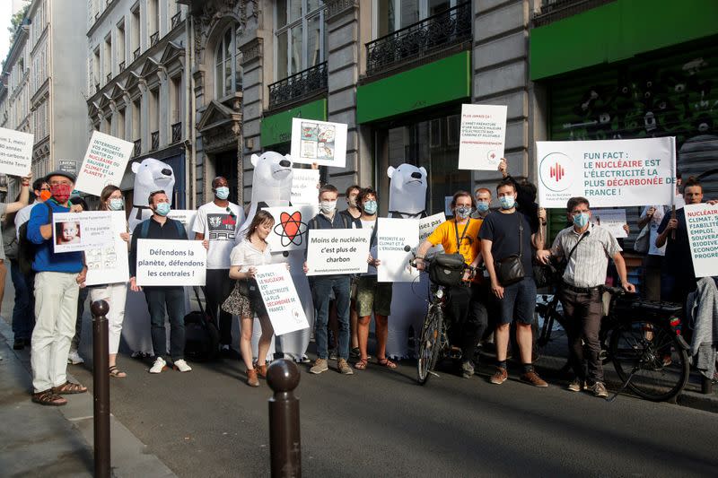 Members of the group "The Voices of Nuclear" demonstrate in reaction to the closure of the Fessenheim nuclear power plant in front of Greenpeace headquarters in Paris