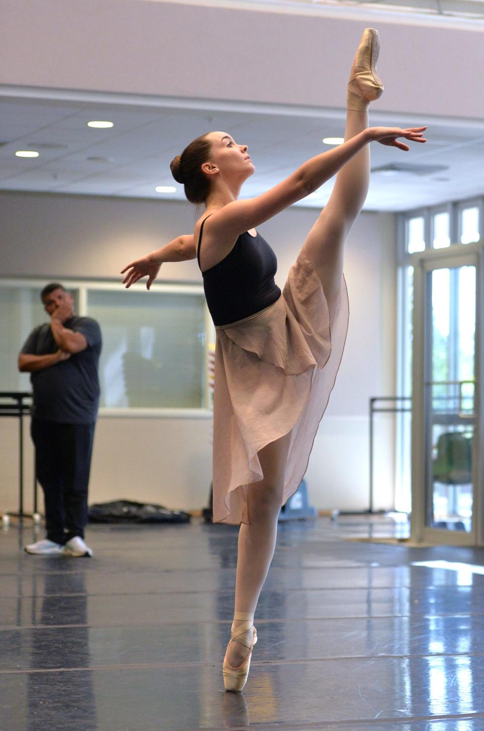 Evelyn Lyman rehearses the part of Soledad in "Tarde en la Siesta" recently at the Sarasota Cuban Ballet School as co-founder Ariel Serrano watches in the background. The Sarasota Cuban Ballet School will present Cuban Choreography Showcase on April 22, 2023 at the Sarasota Opera House. 