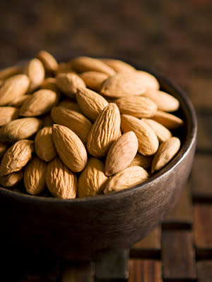 <div class="caption-credit"> Photo by: istock.com</div><b>Almonds: Good for Your Gut</b> <br> Almonds contain the most fiber - about three grams per ounce - compared to other nuts, and are richest in vitamin E, a powerful antioxidant. Almonds may even help you slip into those skinny jeans: In one International Journal of Obesity study, when two groups of obese adults followed low-calorie diets for six months, those who included almonds in their weight loss plans lost more weight than those who ate more complex carbohydrates. Other research shows that almonds are especially healthy for people worried about their blood sugar: Those who ate about 20 percent of their calories from almonds for four months saw their bad LDL cholesterol drop and their insulin resistance decrease compared to a control group who didn't eat them. Almonds may even safeguard your gut: A test-tube study (funded by the Almond Board of California) found that the nuts raised levels of good bacteria that bolster the body's immune system. Serving info: About 23 nuts = 170 c