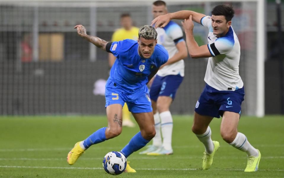 Gianluca Scamacca of Italy competes for the ball against Harry Maguire of England during the UEFA Nations League League - Stefano Guidi/Getty Images