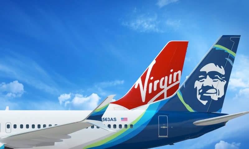 A Virgin America aircraft tail behind an Alaska Airlines plane