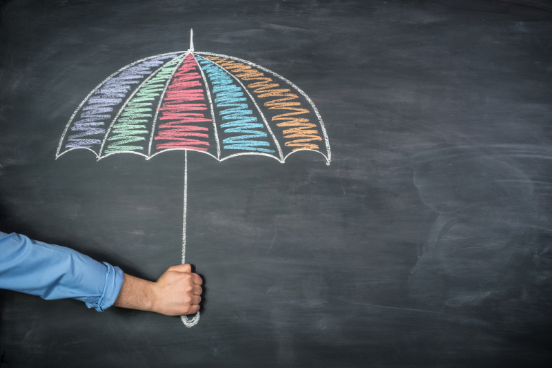 Man Holding Multi-Coloured Umbrella