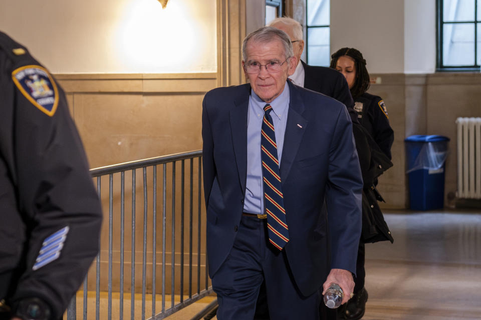 Oliver North enters court in Lower Manhattan on Tuesday, Jan. 23, 2024, in New York. North, the retired Marine who was pushed out as president of the National Rifle Association, testifies in a lawsuit over alleged financial misdeeds by leaders of the gun rights group. North says he was forced out after blowing the whistle on improprieties. (AP Photo/Brittainy Newman)