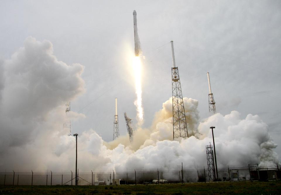 A rocket carrying the SpaceX Dragon ship lifts off from launch complex 40 at the Cape Canaveral Air Force Station in Cape Canaveral, Fla. on Friday, April 18, 2014. The mission will deliver research equipment, food and other supplies to the International Space Station. (AP Photo/John Raoux)