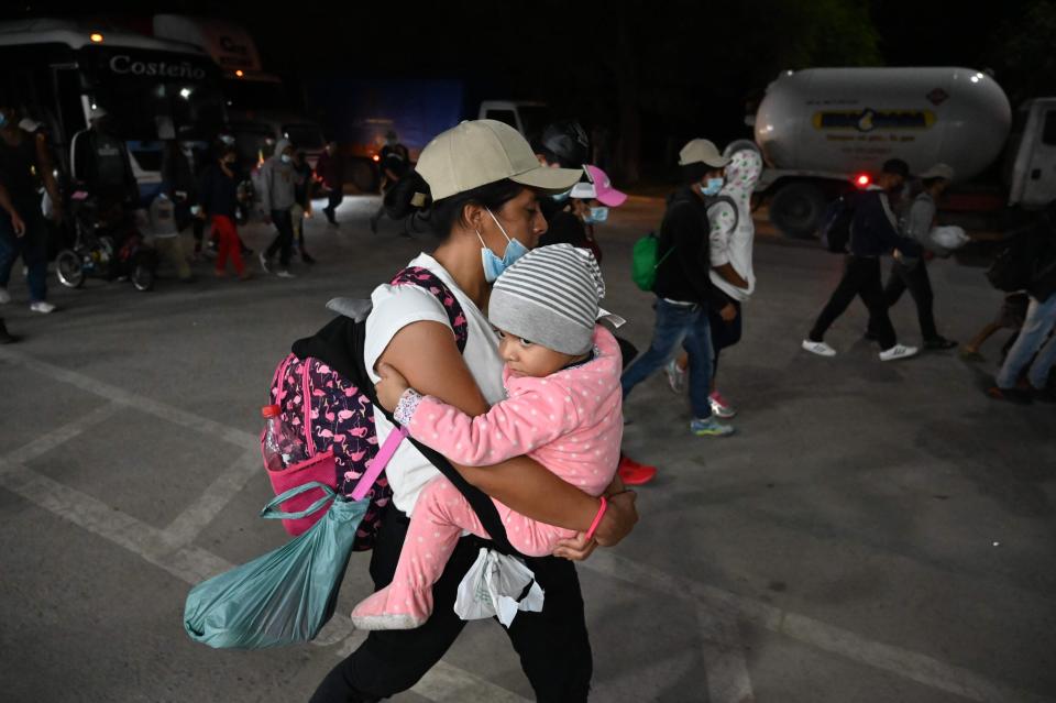 Honduran people leave in a caravan to the United States from San Pedro Sula on Jan. 15, 2021. Hundreds of asylum seekers are forming new migrant caravans in Honduras, planning to walk thousands of kilometers through Central America to the United States via Guatemala and Mexico, in search of a better life under the new administration of President Joe Biden.